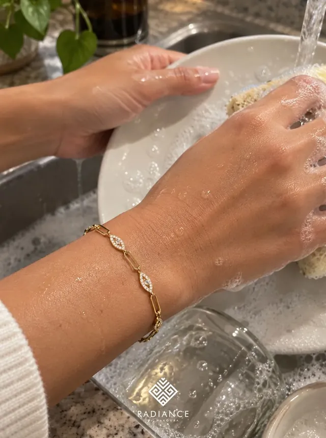 Radiance by Hakoura — gold bracelet while washing dishes