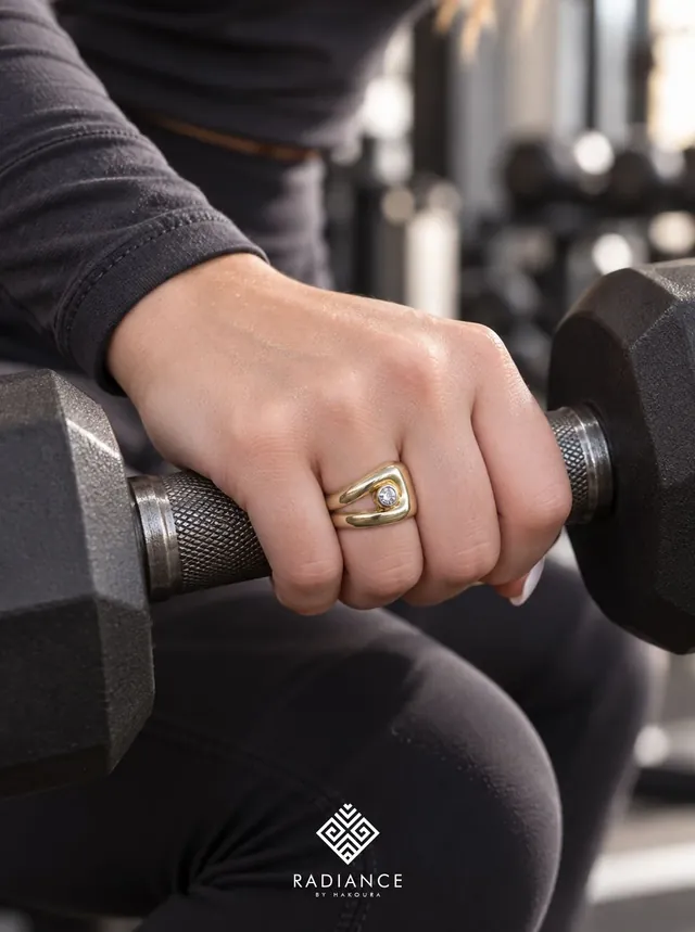 Radiance by Hakoura — gold ring on a dumbbell